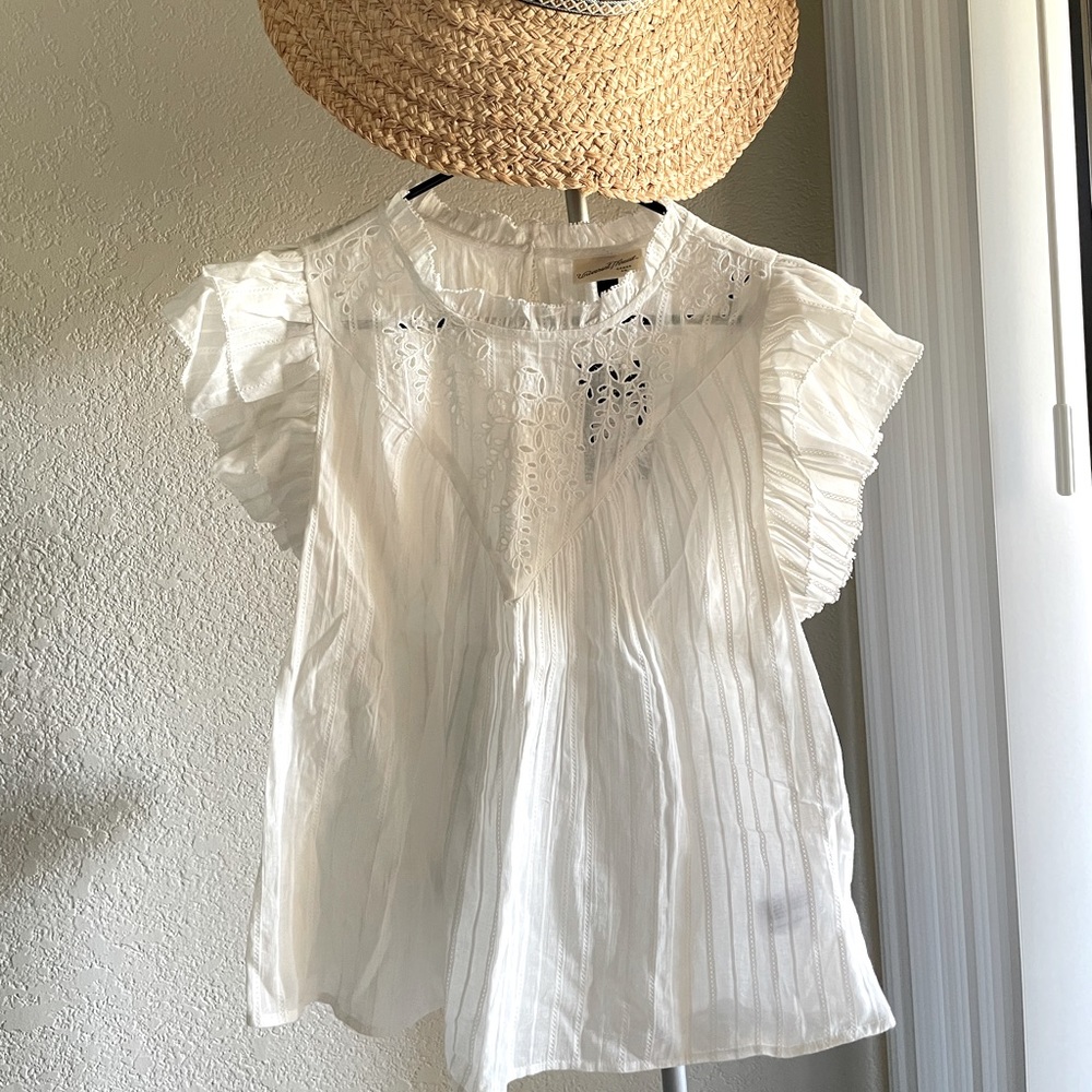 Pure cotton white blouse with Broderi at neck.